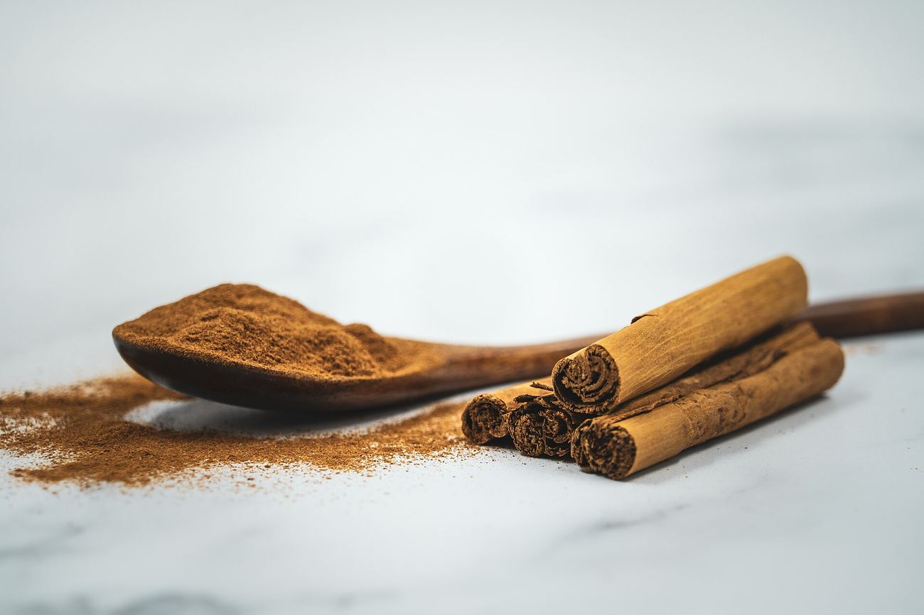 Cinnamon sticks and ground cinnamon, one of our candle ingredients